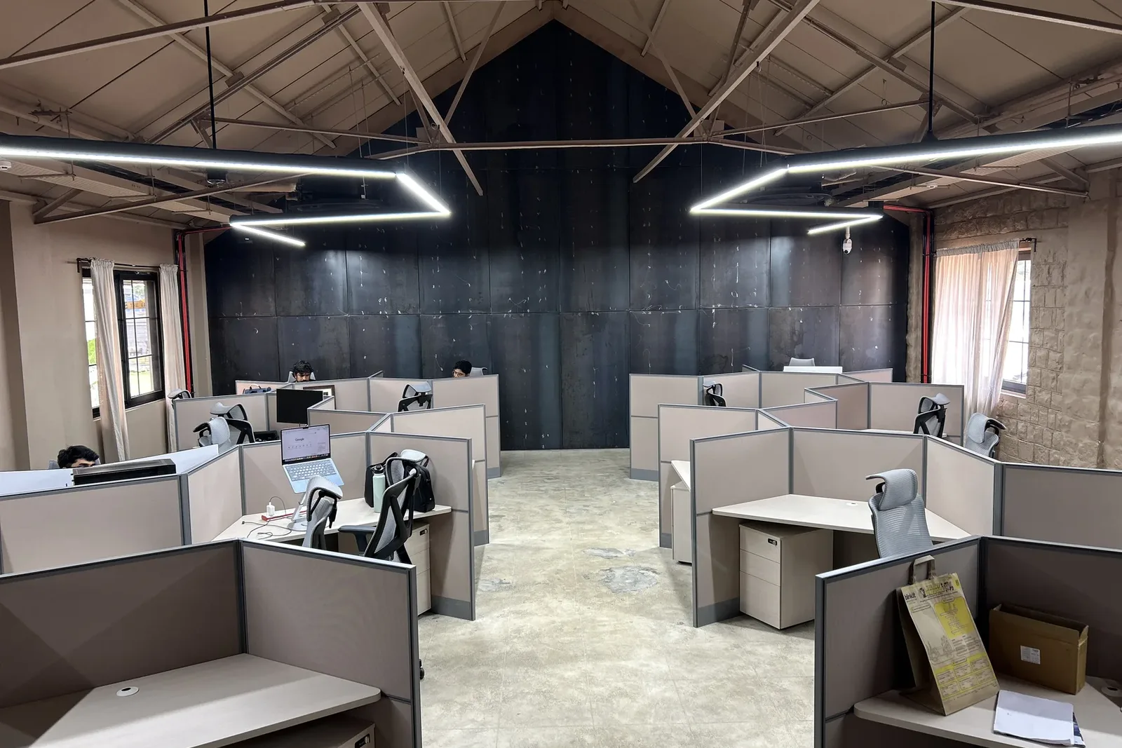 FERRASTACK team members working at desks in the office