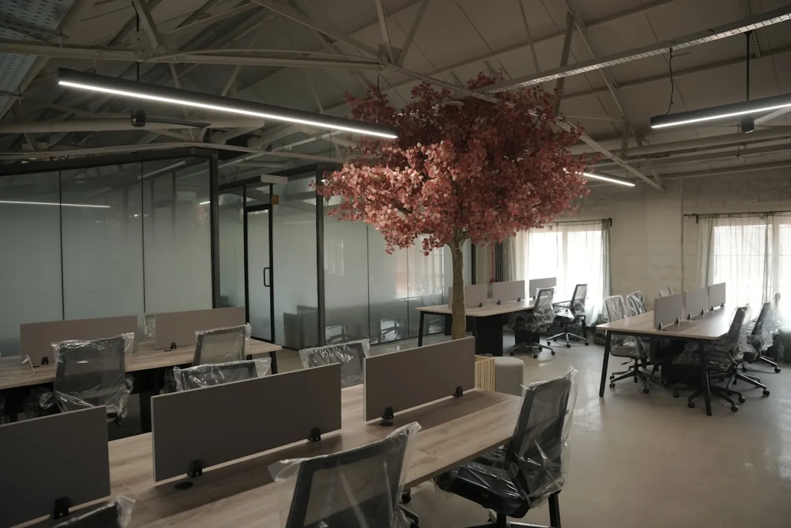 Open-plan desk area inside the FERRASTACK workspace