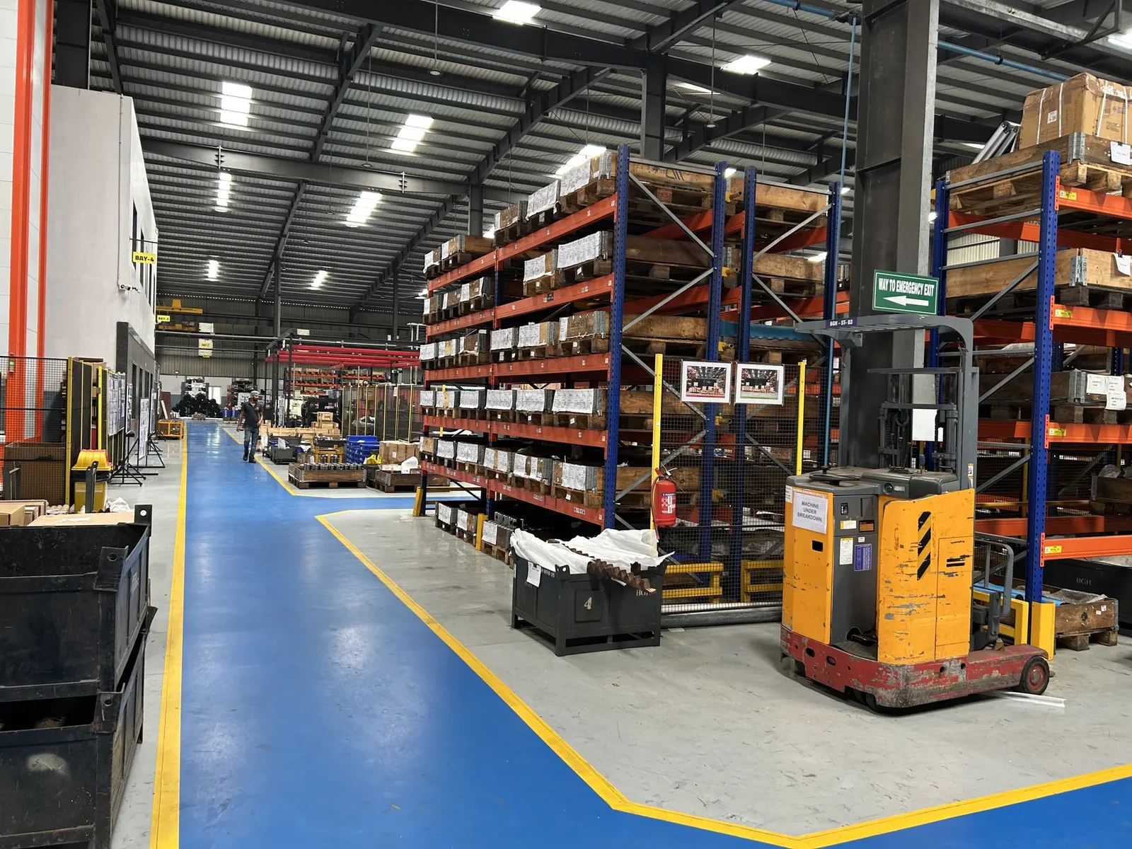 Organized material racks and handling equipment inside a partner manufacturing facility