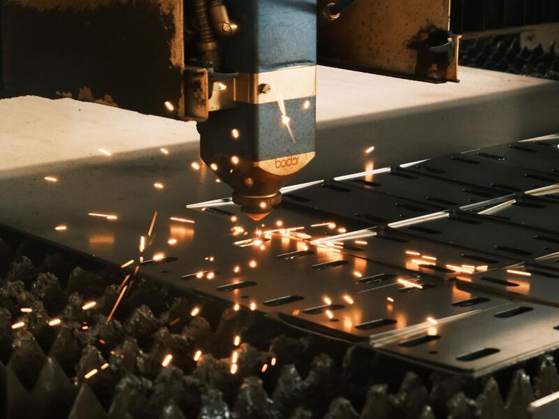 Precision-cut and welded sheet metal industrial assembly