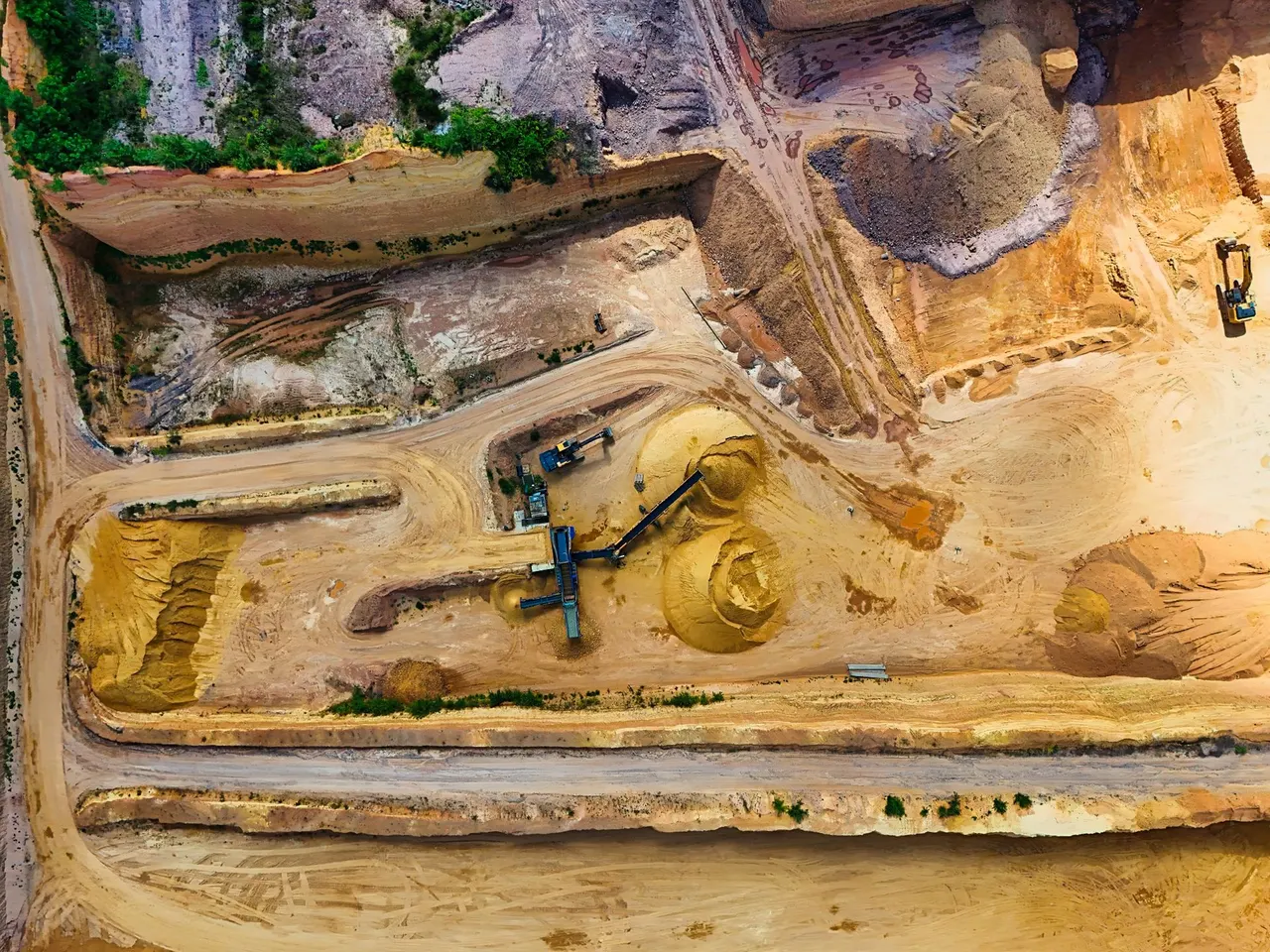 Heavy mining equipment operating at a large industrial site